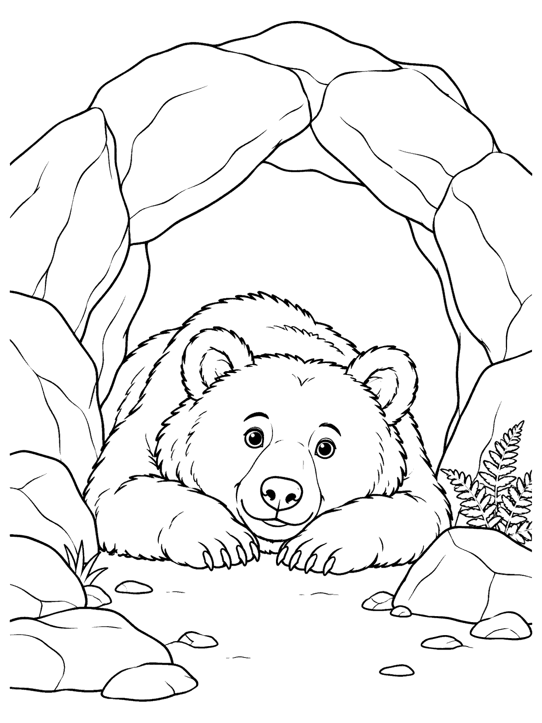 Bear resting with its head and front paws outside a boulder-framed cave, with a small fern.