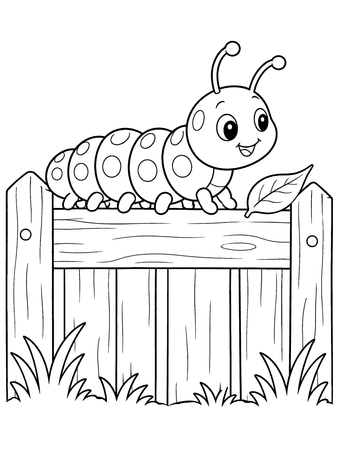 Smiling spotted caterpillar crawling along the top rail of a wooden fence, with a leaf and grass nearby