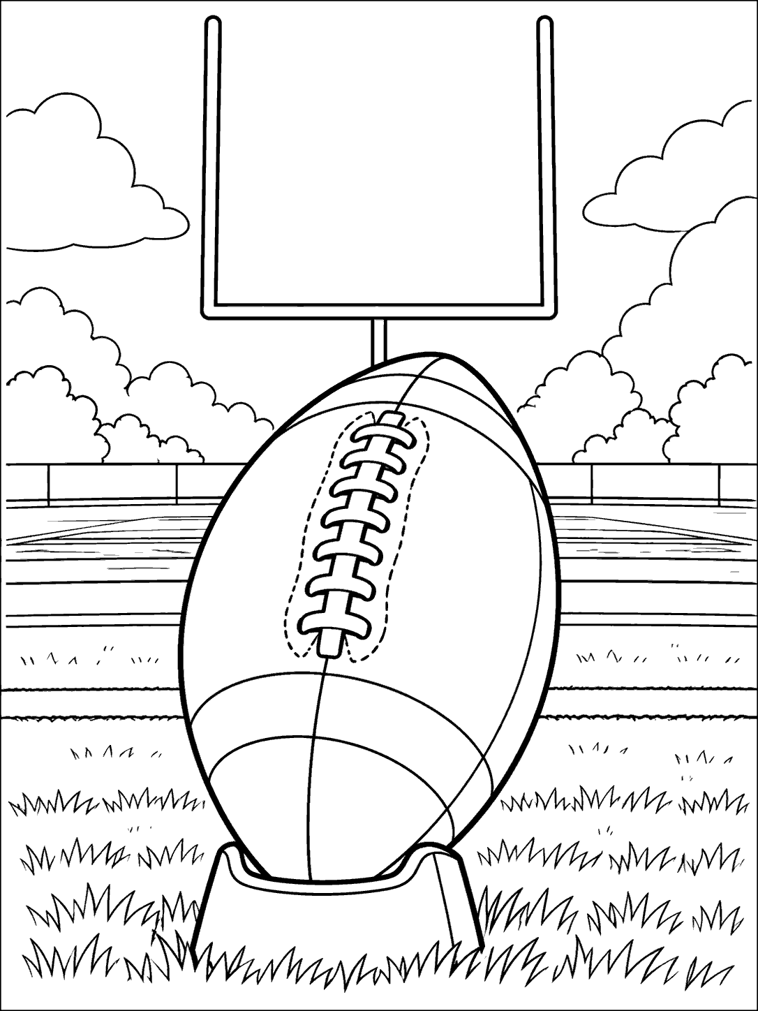 Large football on a kicking tee in front of goalposts and a striped field