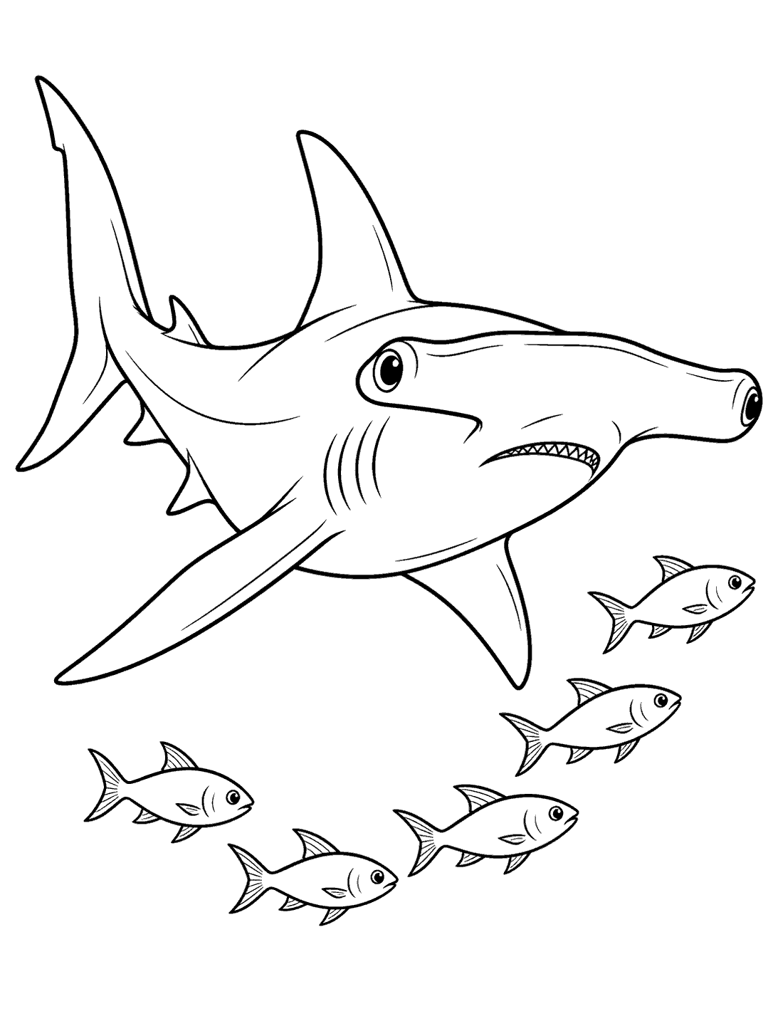 Hammerhead shark passing a small school of fish