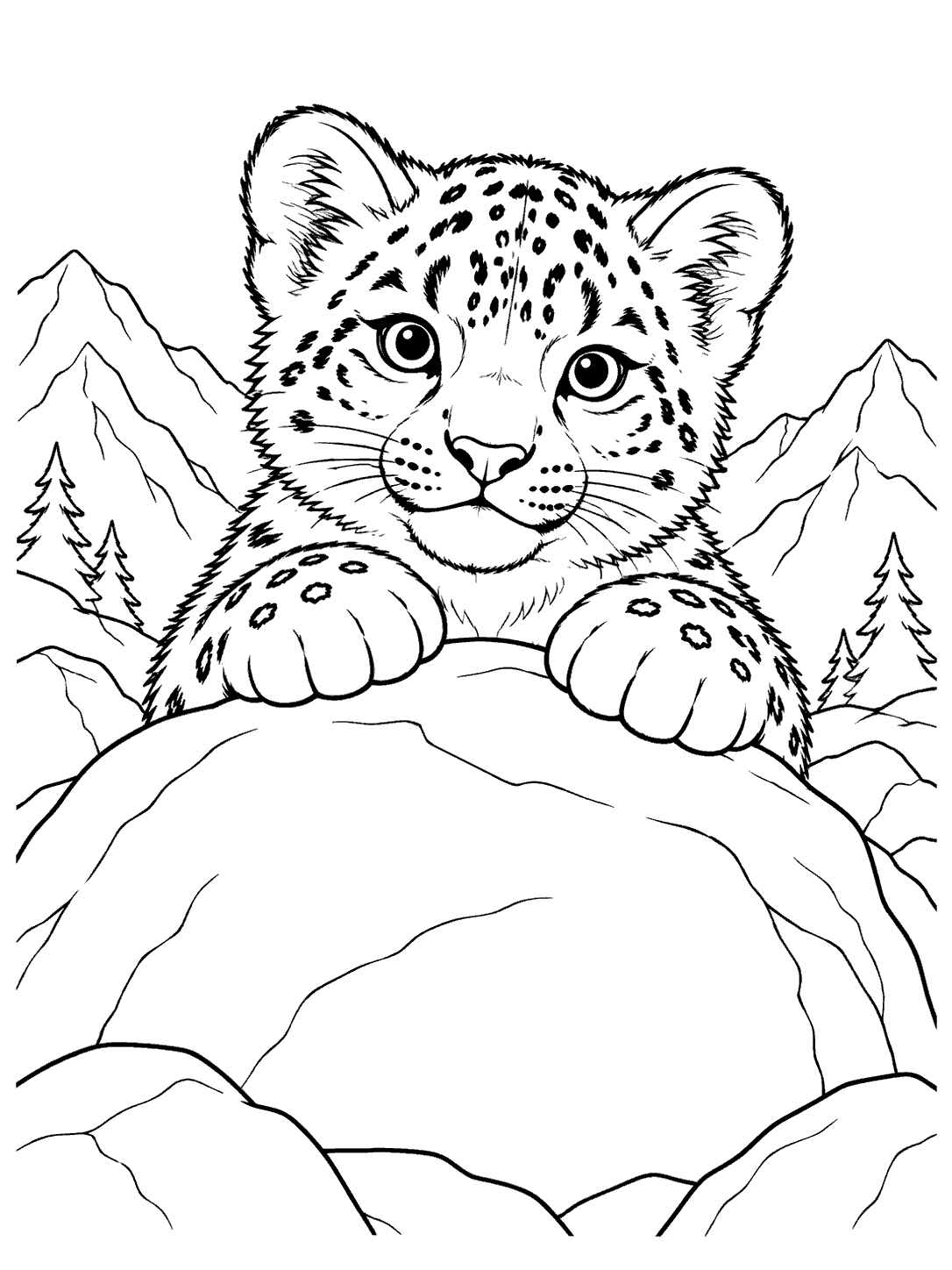Snow leopard cub with spotted paws peeking over a large boulder, with mountains and pine trees in the background.